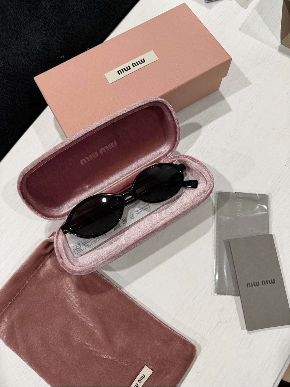 Miu Miu Black Oval Sunglasses with Pink Velvet Case